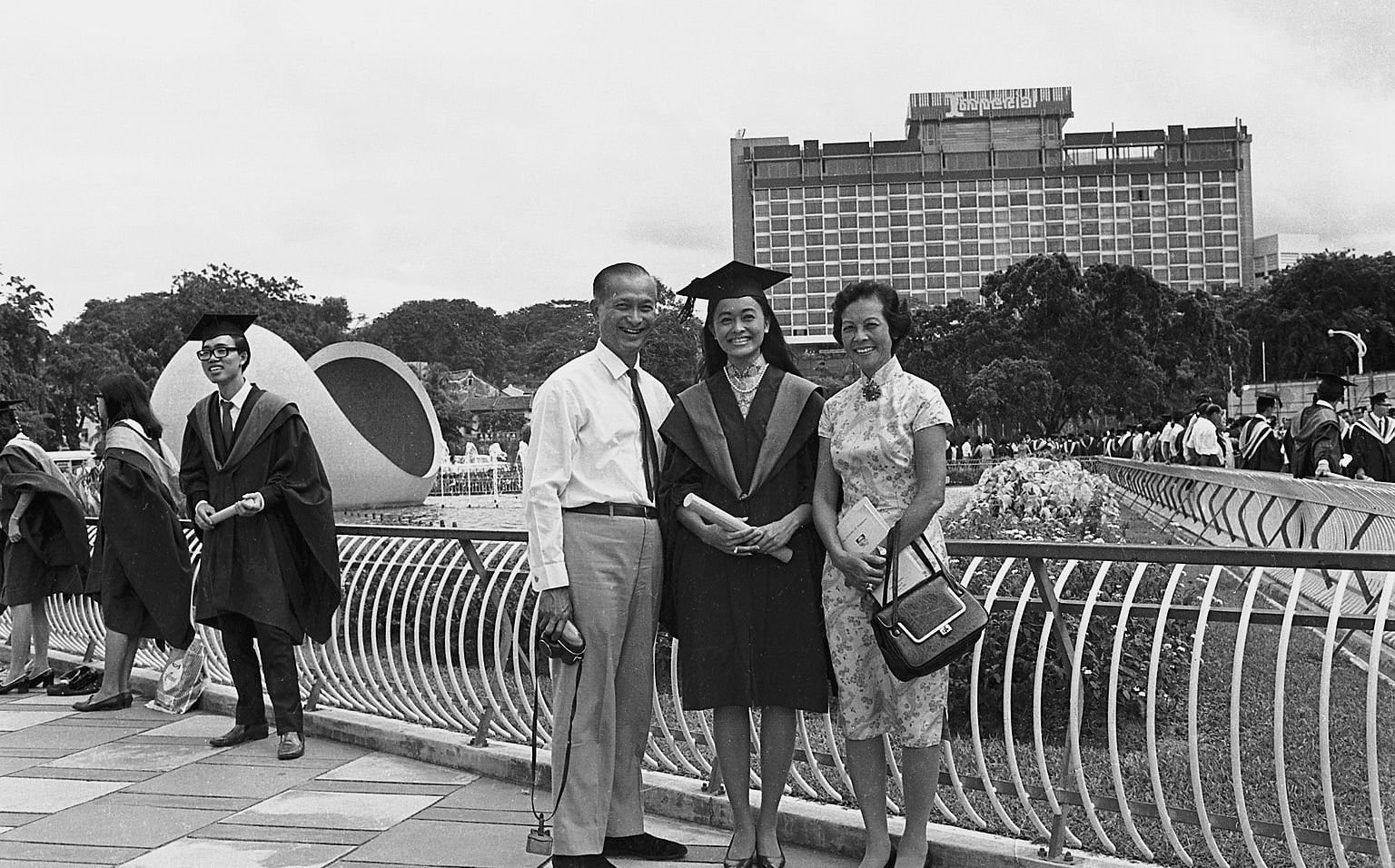 Mr and Mrs Wee Kim Wee posing for a picture with their daughter after the University of Singapore convocation at the National Theatre.