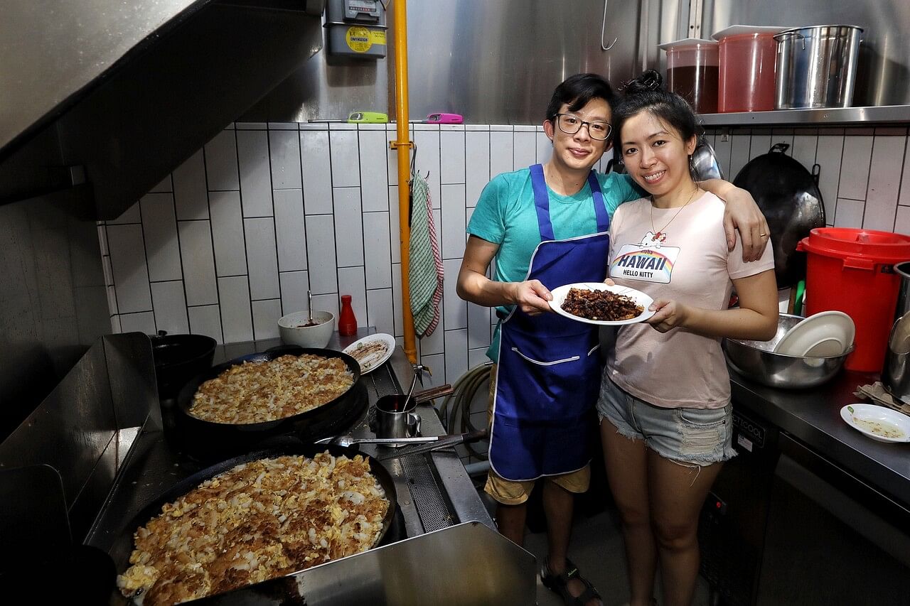 Ms Ang and Mr Tan with their signature crispy black carrot cake, which has become a hot seller on their menu.