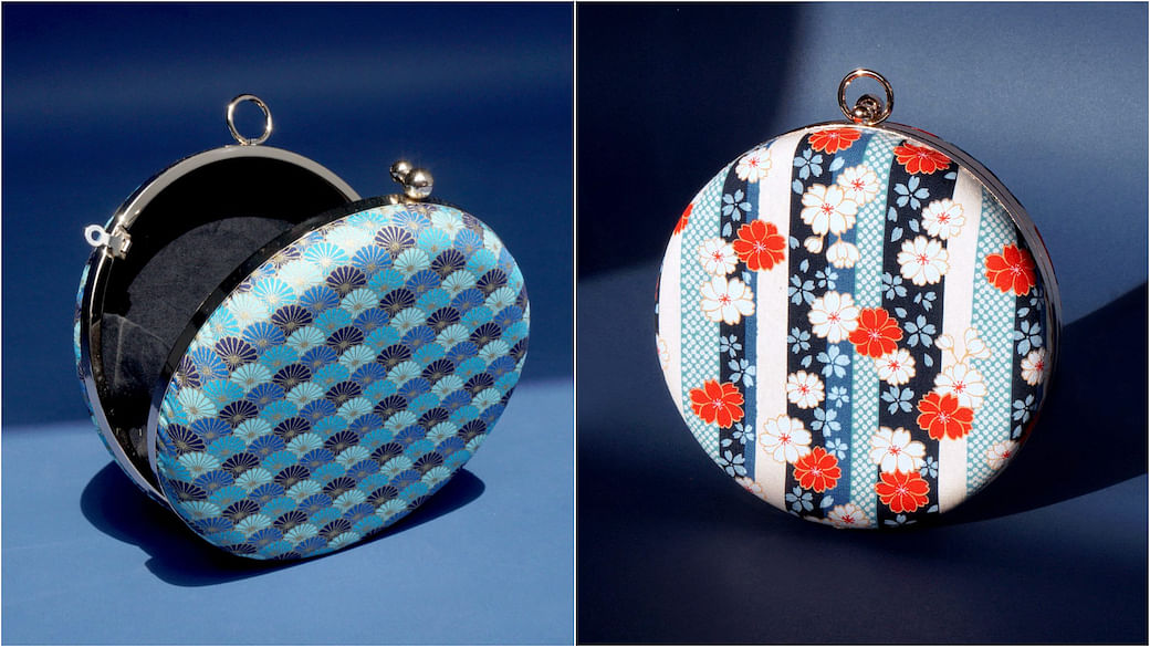From left: Round Clutch Bag Kikkamon and Round Clutch Bag Kiku Archives, both by Cocoonese