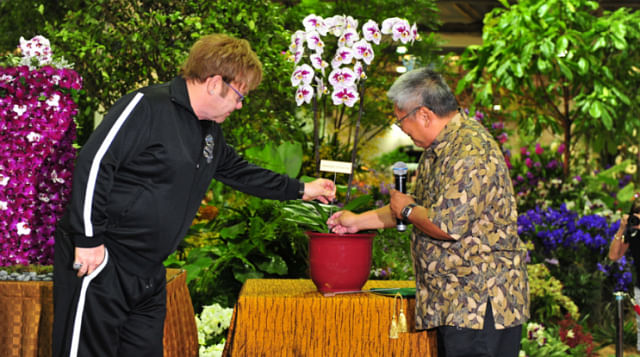 Sir Elton John completing the orchid naming ceremony at 20th World Orchid Ceremony in Singapore