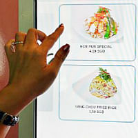 Get fried rice and other local dishes at vending machines in Singapore